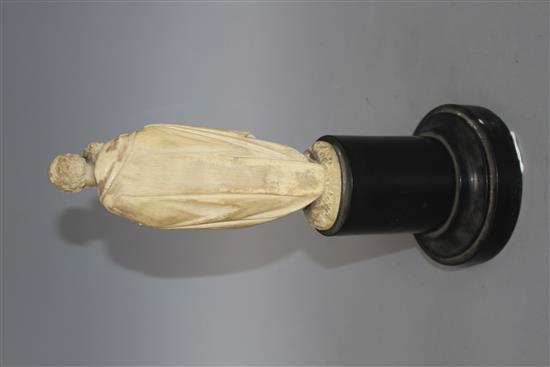 A 19th century Dieppe carved ivory figure of St Joseph holding the Christ child, 16cm, on ebony socle, overall height 26.5cm